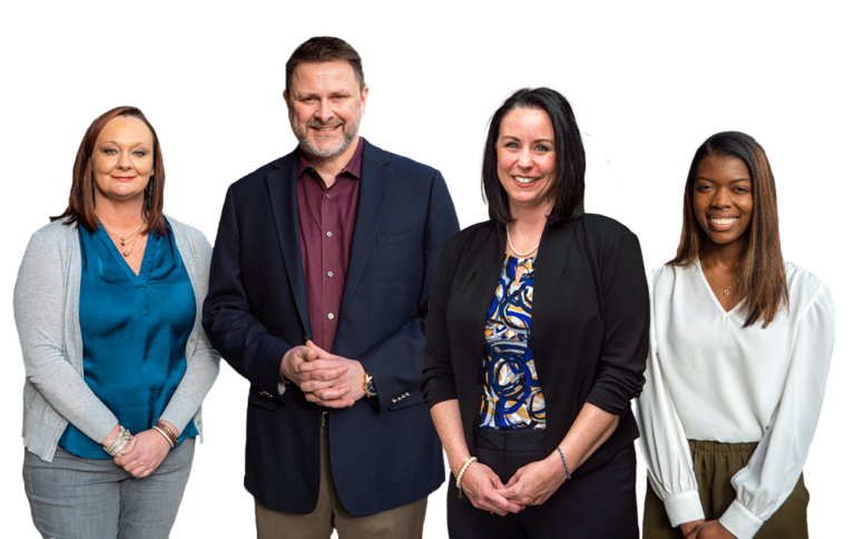 Group portrait of the Gentry Professional Services team smiling and looking at the camera.